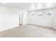 Spacious bedroom with neutral carpeting, white walls, and plenty of natural light at 571 Homestead Ave, Brighton, CO 80601