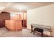 Basement featuring a wood bar with counter space and a piano for entertainment at 3544 Dyanna Dr, Thornton, CO 80241