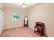 Unfurnished bedroom featuring a large window, closet, and vintage desk with mirror at 3544 Dyanna Dr, Thornton, CO 80241
