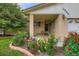 Inviting front porch with colorful flowerbeds at 3544 Dyanna Dr, Thornton, CO 80241