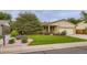 Charming one-story home featuring a well-manicured lawn and vibrant flowerbeds at 3544 Dyanna Dr, Thornton, CO 80241