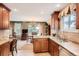 Bright kitchen featuring granite countertops, stainless steel sink, and view to the backyard at 3544 Dyanna Dr, Thornton, CO 80241