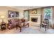 Cozy living room with a brick fireplace and comfortable seating at 3544 Dyanna Dr, Thornton, CO 80241