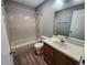 Classic bathroom with a tub/shower combo, vanity with sink, and tiled floor at 14499 E 1St Dr # A05, Aurora, CO 80011