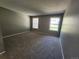 Large bedroom with carpet, two windows providing natural light, and gray painted walls at 14499 E 1St Dr # A05, Aurora, CO 80011