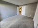 Bedroom with neutral carpet and paint, offering a clean and bright space at 14499 E 1St Dr # A05, Aurora, CO 80011