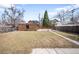 Expansive backyard featuring a detached brick structure and plenty of green space at 2686 S Gilpin St, Denver, CO 80210