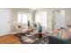 Cozy living room with modern furnishings, lots of light, and hardwood floors at 2686 S Gilpin St, Denver, CO 80210