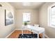 Bright office with a white desk, hardwood floors, a patterned rug, and natural lighting at 2686 S Gilpin St, Denver, CO 80210