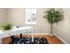 Bright office with a white desk, hardwood floors, and a large window for natural light at 2686 S Gilpin St, Denver, CO 80210