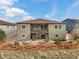 Two-story house featuring a backyard with a wooden fence and patio at 12431 Red Fox Way, Broomfield, CO 80021