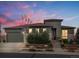 Charming home featuring a stone and siding facade, landscaped front yard, and attached two-car garage at 12431 Red Fox Way, Broomfield, CO 80021