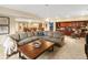 Cozy living room with oversized sectional sofa and built-in shelving at 12431 Red Fox Way, Broomfield, CO 80021