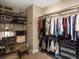 Well-organized walk-in closet provides ample storage with shelving, racks, and a comfortable dressing area at 12431 Red Fox Way, Broomfield, CO 80021