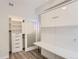 Bright bedroom with a Murphy bed, closet and desk unit at 2120 N Downing St # 216, Denver, CO 80205