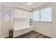 Bright bedroom features a Murphy bed and an adjacent window at 2120 N Downing St # 216, Denver, CO 80205