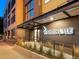 Exterior shot of the well-lit building entrance at 2120 N Downing St # 216, Denver, CO 80205
