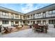 Well-appointed courtyard with lounge furniture and gas fire pit at 2120 N Downing St # 216, Denver, CO 80205