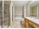 Spacious bathroom features a tiled shower and soaker tub at 9816 W Freiburg Dr # A, Littleton, CO 80127