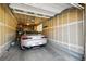 Car inside of a spacious two-car garage with ample ceiling storage at 9816 W Freiburg Dr # A, Littleton, CO 80127