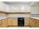 Close up of kitchen cabinets and dishwasher at 9816 W Freiburg Dr # A, Littleton, CO 80127