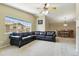 Living room featuring vaulted ceiling, carpet, large window, and an open floor plan at 9816 W Freiburg Dr # A, Littleton, CO 80127