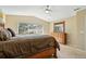 Main bedroom with a window showing views of the landscape at 9816 W Freiburg Dr # A, Littleton, CO 80127