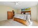 Spacious main bedroom features a ceiling fan, ensuite bathroom and an exterior window at 9816 W Freiburg Dr # A, Littleton, CO 80127
