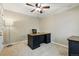 Home office with neutral walls, carpeted flooring, and a ceiling fan at 9816 W Freiburg Dr # A, Littleton, CO 80127