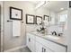 Bathroom with double sinks, elegant fixtures, and a stylish vanity at 2226 S Galapago St, Denver, CO 80223