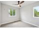 Bedroom with carpeted floors and dual windows for natural light at 2226 S Galapago St, Denver, CO 80223