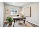 Bright and airy home office with ample natural light and stylish decor at 2226 S Galapago St, Denver, CO 80223