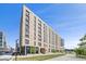 Modern building featuring clean lines, large windows, and a contemporary design, set against a clear blue sky at 3575 Chestnut Pl # 702, Denver, CO 80216