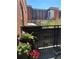 Charming balcony view with plants and bistro set overlooking city buildings at 1975 N Grant # 310, Denver, CO 80203