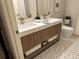 Bathroom featuring double sinks with modern fixtures and mosaic tile flooring at 1975 N Grant # 310, Denver, CO 80203