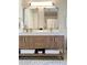 Elegant bathroom vanity with double mirrors, dual sinks, marble countertops and ample storage at 1975 N Grant # 310, Denver, CO 80203
