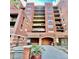 Beautiful brick condo building, featuring a prominent entrance and multiple balconies at 1975 N Grant # 310, Denver, CO 80203