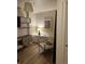 Bright home office featuring stylish shelving unit, seating and accent lighting at 1975 N Grant # 310, Denver, CO 80203