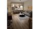 Open floor plan featuring a living room with a gray sofa and a kitchen with breakfast bar seating at 1975 N Grant # 310, Denver, CO 80203