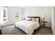 Light filled bedroom featuring stylish lamps, two windows and neutral tones at 8408 W 52Nd Ave, Arvada, CO 80002