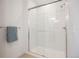 Modern glass enclosed shower with subway tile surround and a neutral color scheme at 8408 W 52Nd Ave, Arvada, CO 80002