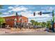 Street view featuring charming shops, outdoor dining, and a vibrant atmosphere in a brick building at 8408 W 52Nd Ave, Arvada, CO 80002