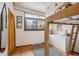 Bedroom with hardwood floors, lofted bed, and a window overlooking the yard at 1423 S Eudora St, Denver, CO 80222