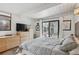 Cozy bedroom features a sliding glass door to backyard and stylish decor at 1423 S Eudora St, Denver, CO 80222