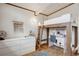Bedroom featuring a lofted bed with desk and drawers, hardwood floors and bright lighting at 1423 S Eudora St, Denver, CO 80222