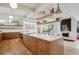 Bright kitchen featuring stainless steel appliances, quartz countertops, and modern cabinetry at 1423 S Eudora St, Denver, CO 80222