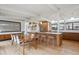 Bright kitchen with a breakfast bar, wooden cabinets, modern appliances, and an open dining area at 1423 S Eudora St, Denver, CO 80222