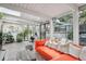 Bright living room with brick floors, comfortable seating, and indoor plants at 1423 S Eudora St, Denver, CO 80222