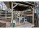 Covered outdoor dining area featuring a wooden pergola, ample seating, and a charming setting at 1423 S Eudora St, Denver, CO 80222