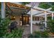 Backyard patio with a pergola, string lights, grill, and seating area, perfect for outdoor living at 10701 Flagler Dr, Parker, CO 80134